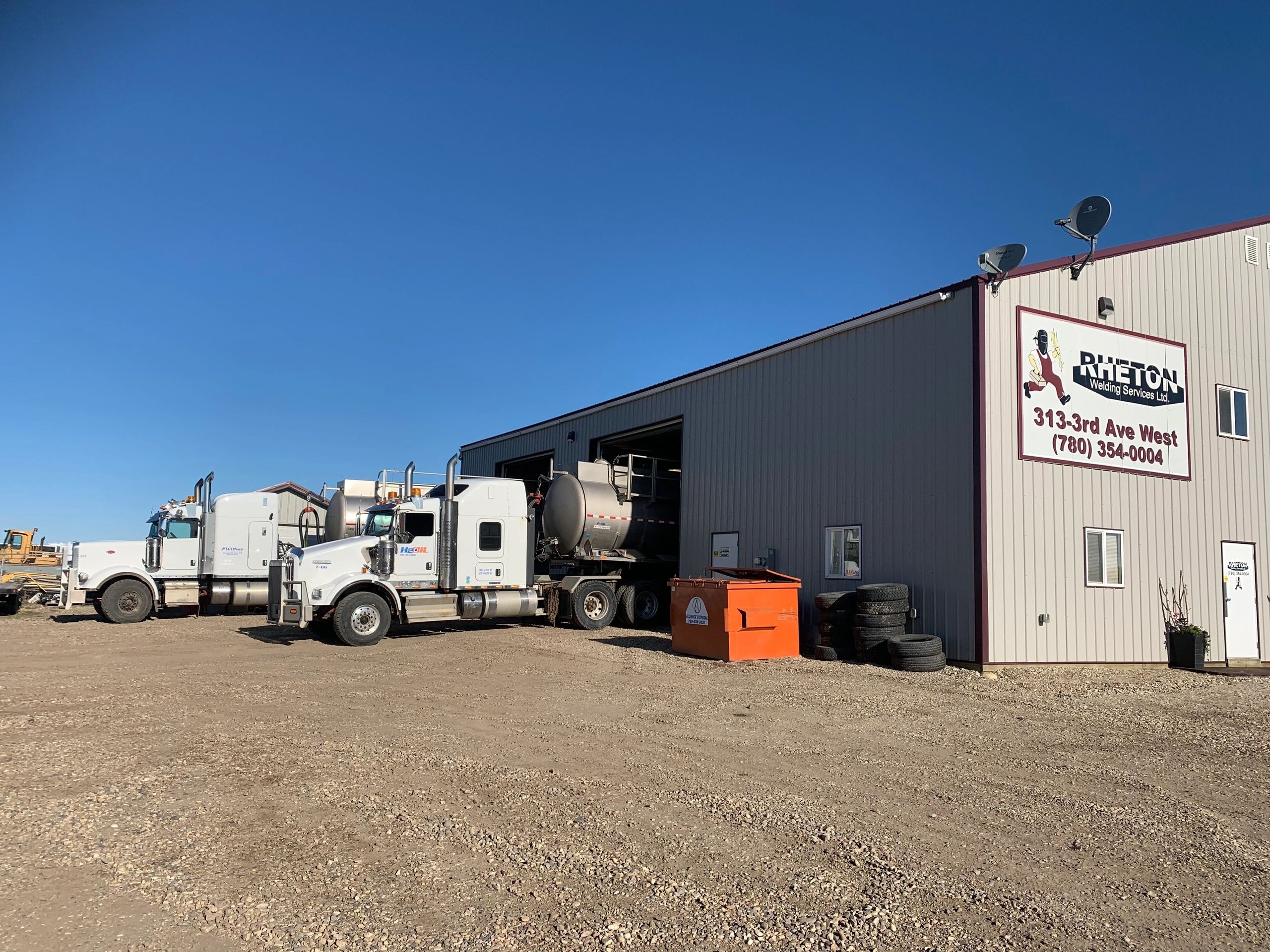 Rheton Welding service trucks at facility